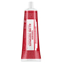 A red and white tube labeled Dr. Bronners All One Cinnamon Toothpaste sits upright, featuring text about fair trade, organic ingredients, and packaging made from sustainable materials [5 oz]