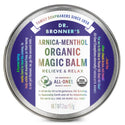 A round tin labeled Dr. Bronners Arnica Menthol Organic Magic Balm sits centered, emphasizing relief and relaxation. Surrounding text highlights benefits and ethical principles. The tin weighs 2 oz57 g, promoting eco friendly, organic skincare [2 oz]